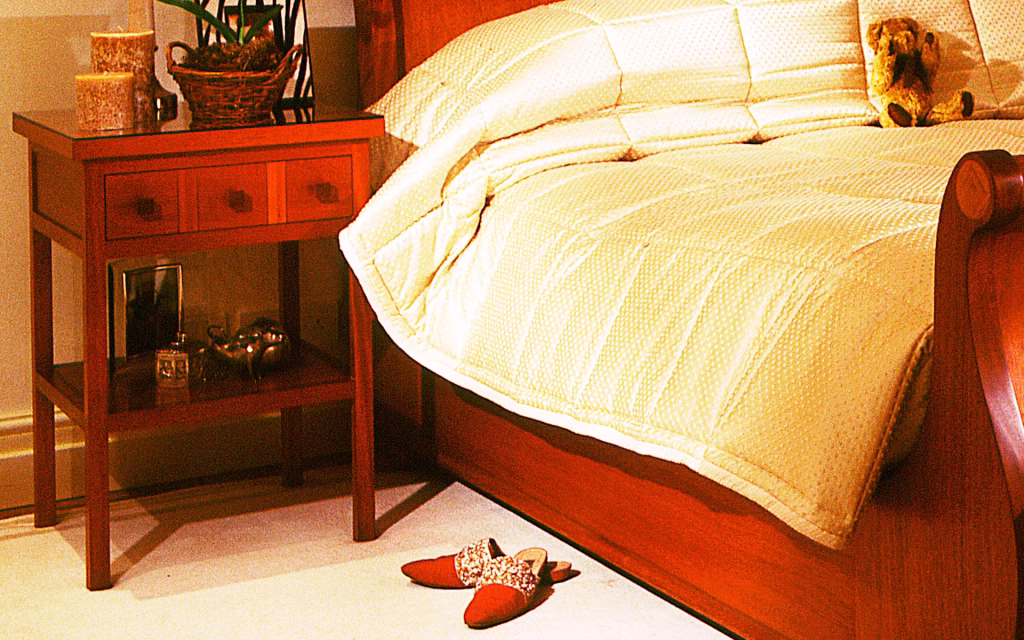 Bedside Side Tables in Mahogany - TIM WOOD Bedside Side Tables in Mahogany The two bedside tables are made in Brazilian mahogany both with one drawer looking like three and a lower shelf area.